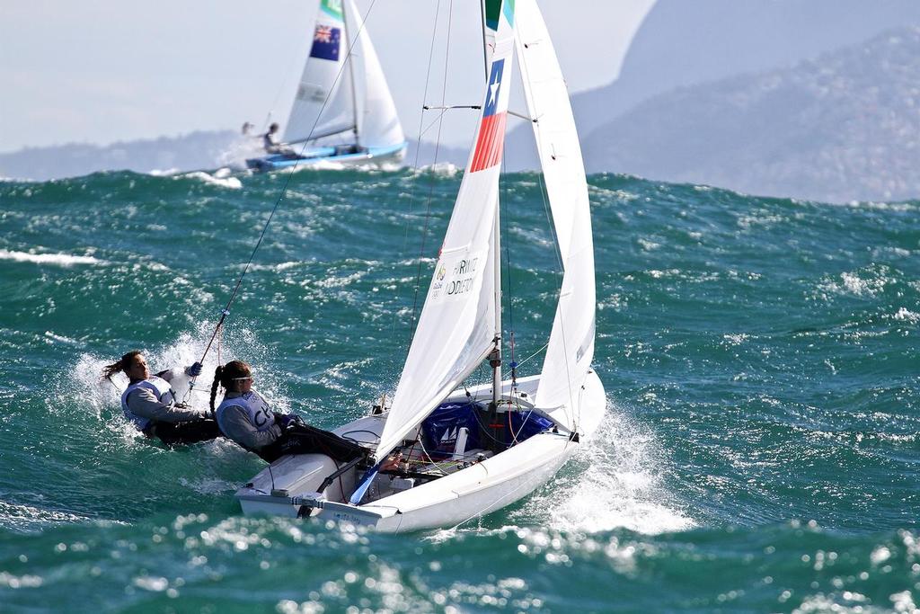 Jo Aleh and Polly Powrie on top of the swell chads Nadja Horowitz and Ana Luiza Barbachan (CHI) in race 4 of the Womens 470 sailed in 3-4 metre Atlantic swells and 20-25kt winds - 2016 Olympics © Richard Gladwell www.photosport.co.nz